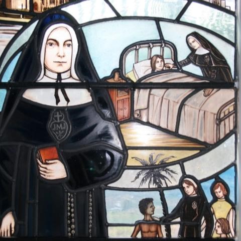Photo of stained glass window depicting Elizabeth Prout.