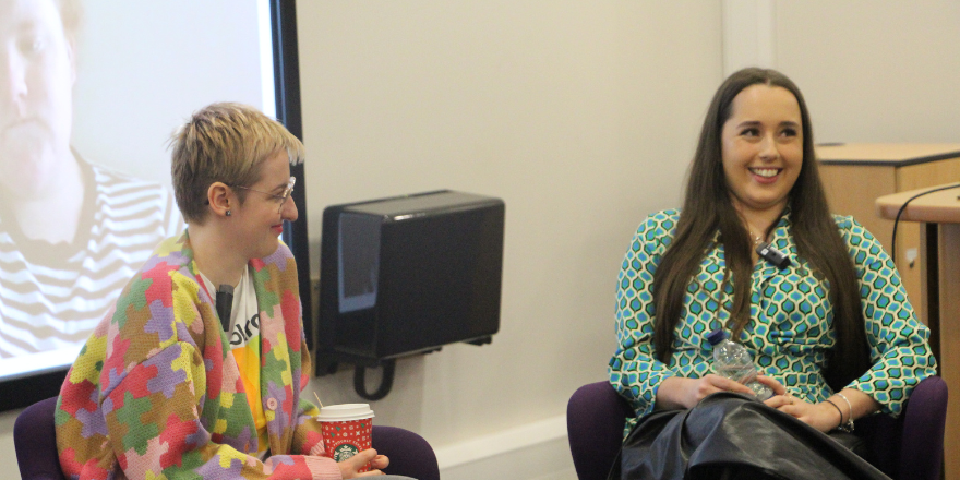 Two females discussing journalism careers