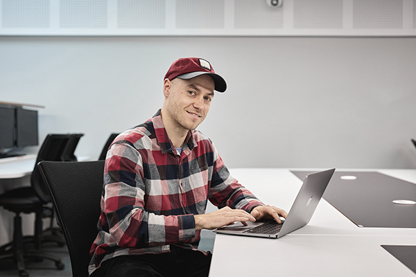 Postgraduate student studying with laptop